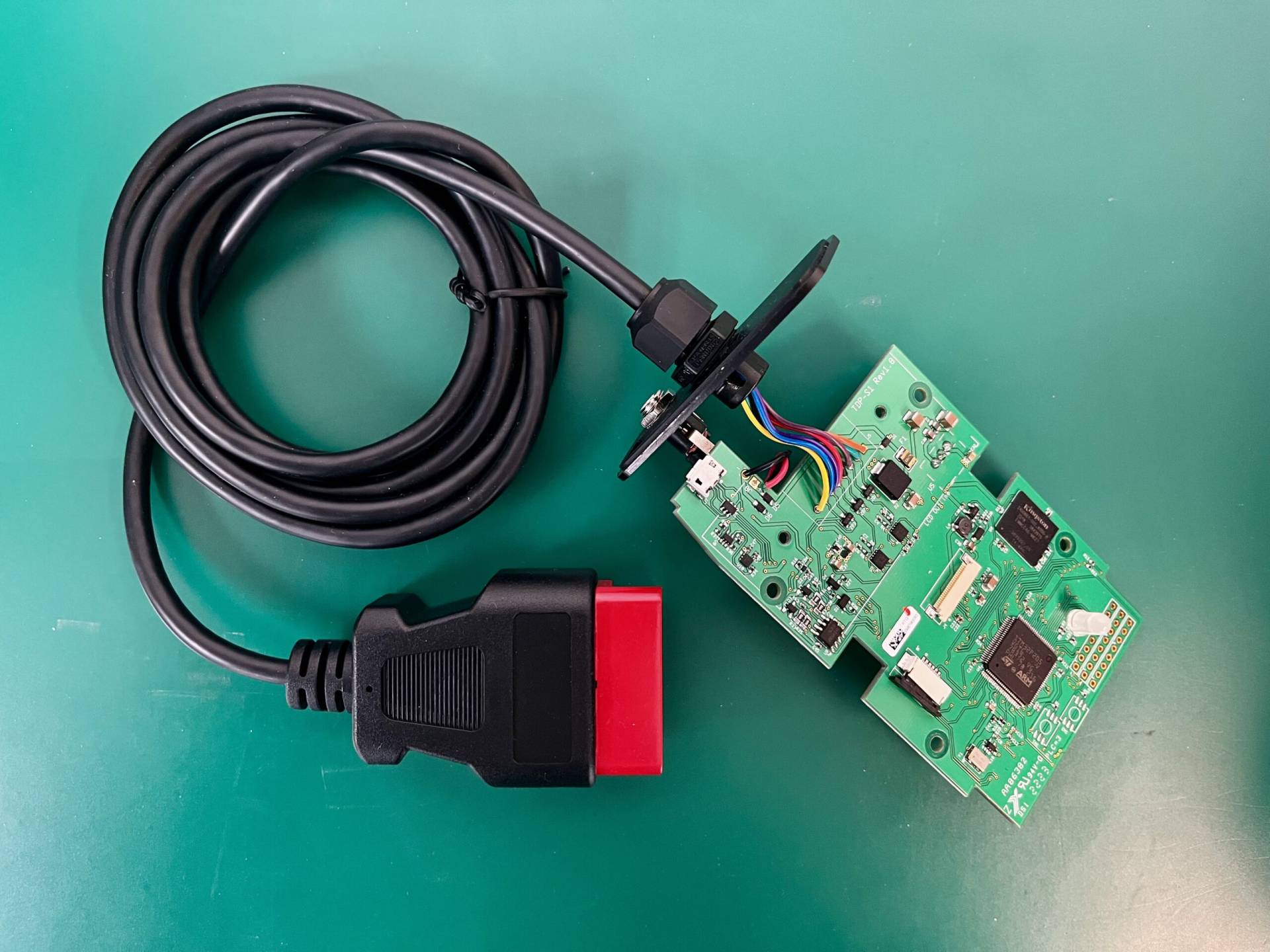 Custom wire harness connected to a PCB, demonstrating precise cable assembly and electronic integration at MAKS Inc.