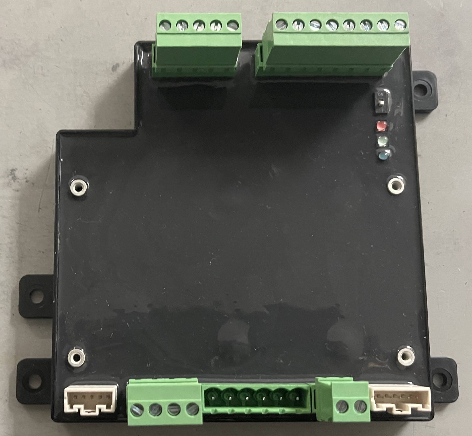 Potting of a circuit board with secured connections and terminal blocks, providing durability and protection for electronic components at MAKS Inc.