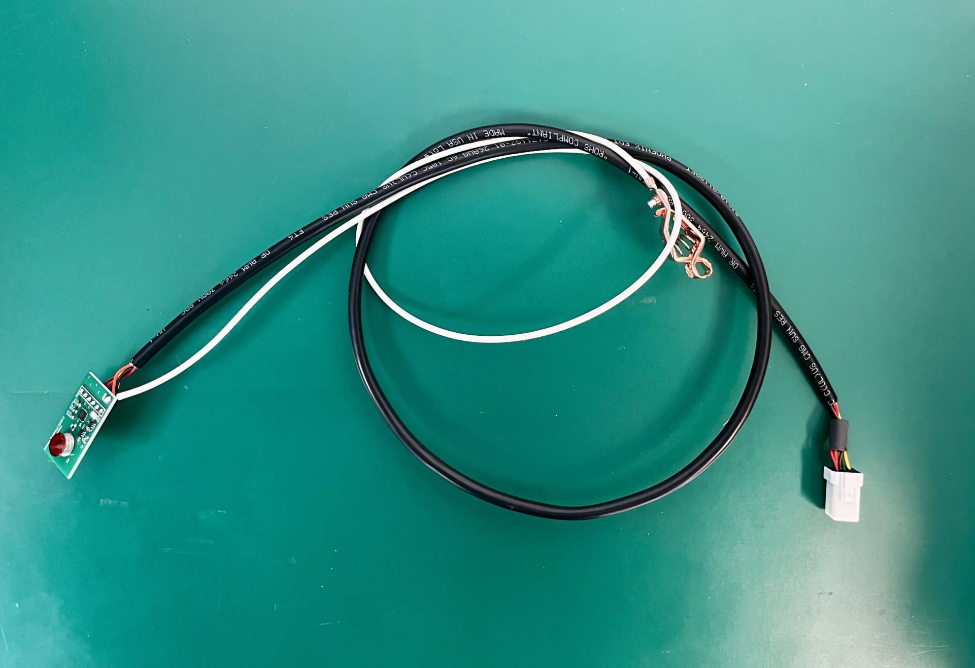 Custom wire harness assembly with connectors and PCB interface, showcasing precise cable management for electronic applications at MAKS Inc.