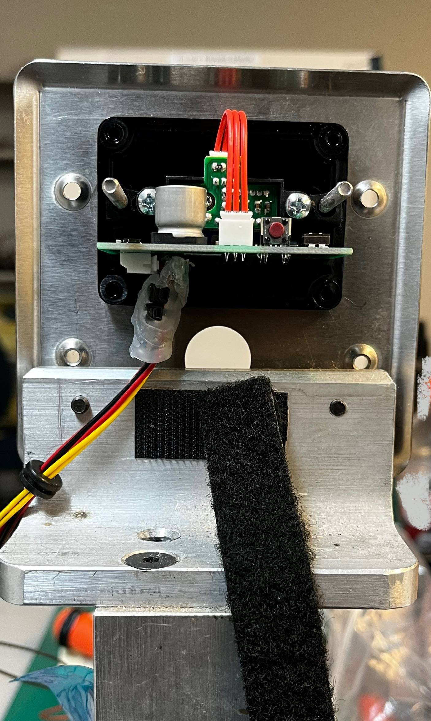 Potting of a circuit board with secured connections and terminal blocks, providing durability and protection for electronic components at MAKS Inc.